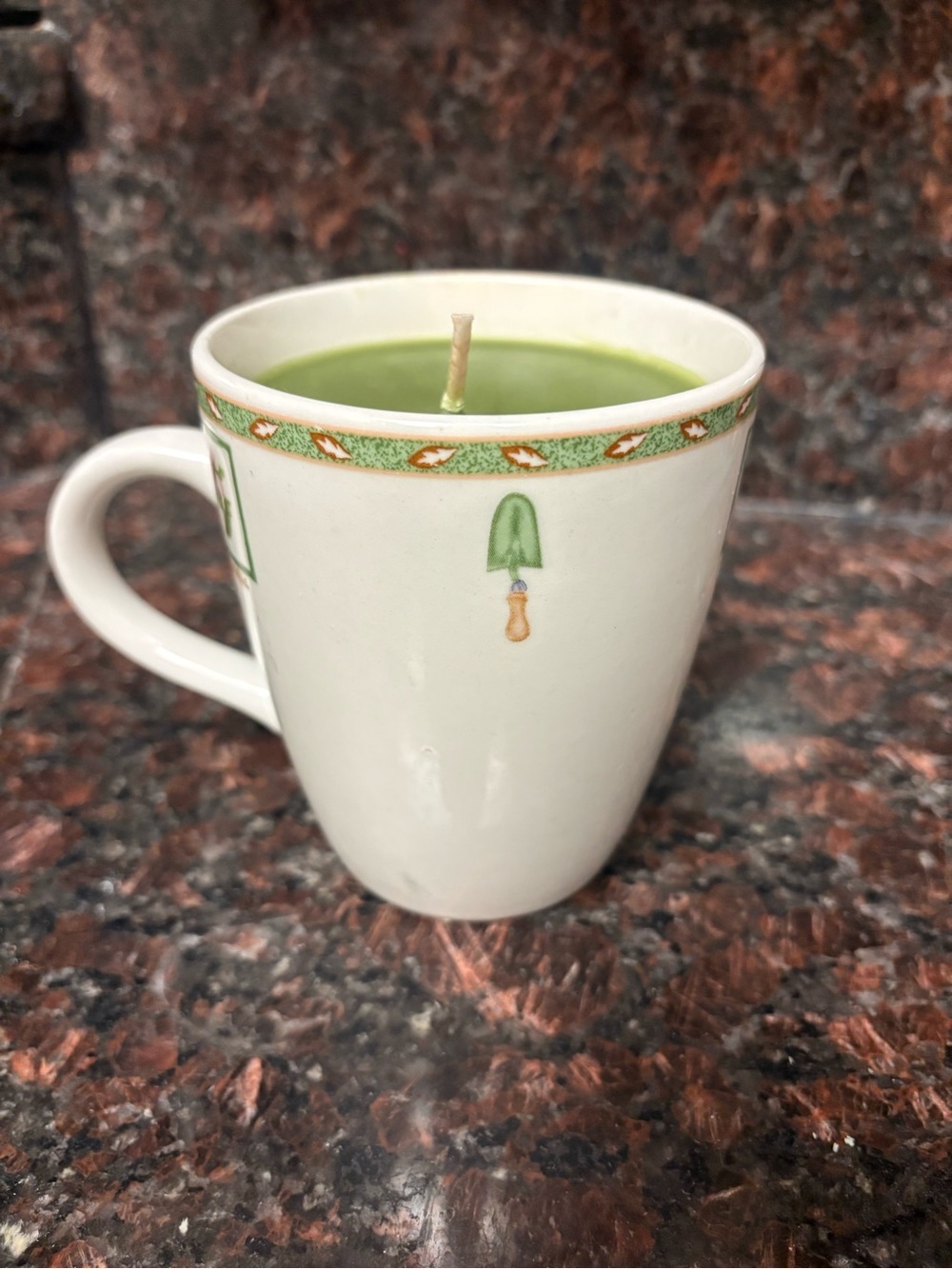 Handmade upcycled candle basil pine scented wax poured into a gardening mug